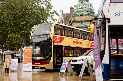 A picture of a bus in the middle of Hull City CEntre